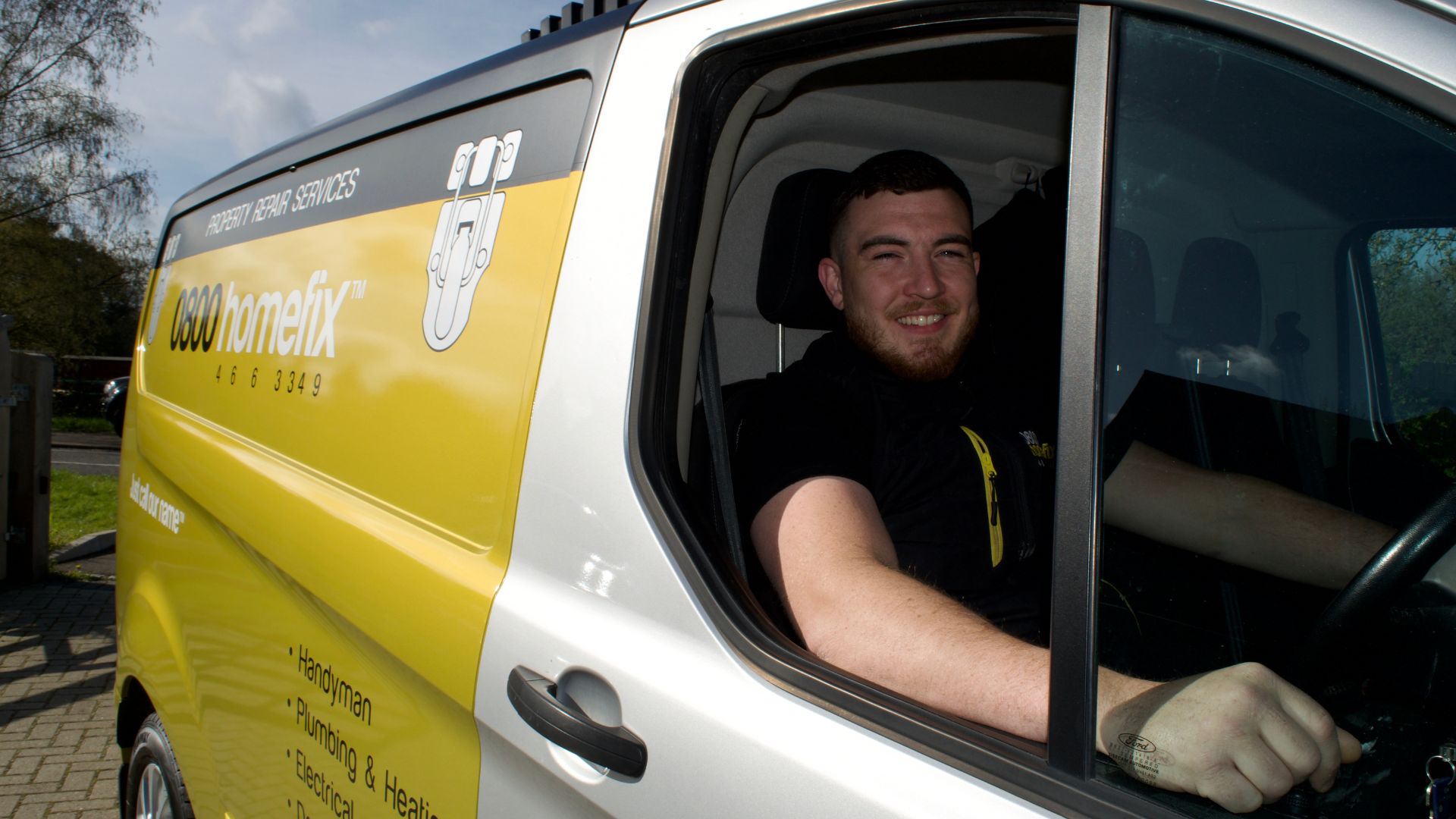 0800 Homefix Plumbing & Heating Engineer sitting in his branded company van