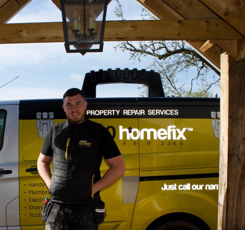 0800 Homefix Plumbing & Heating Engineer standing in front of company work van